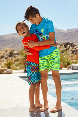 little boy in swim trunks
